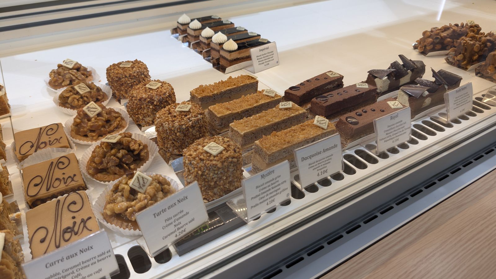 Walnut cakes and chocolate slices in a pâtisserie, Castelnaud