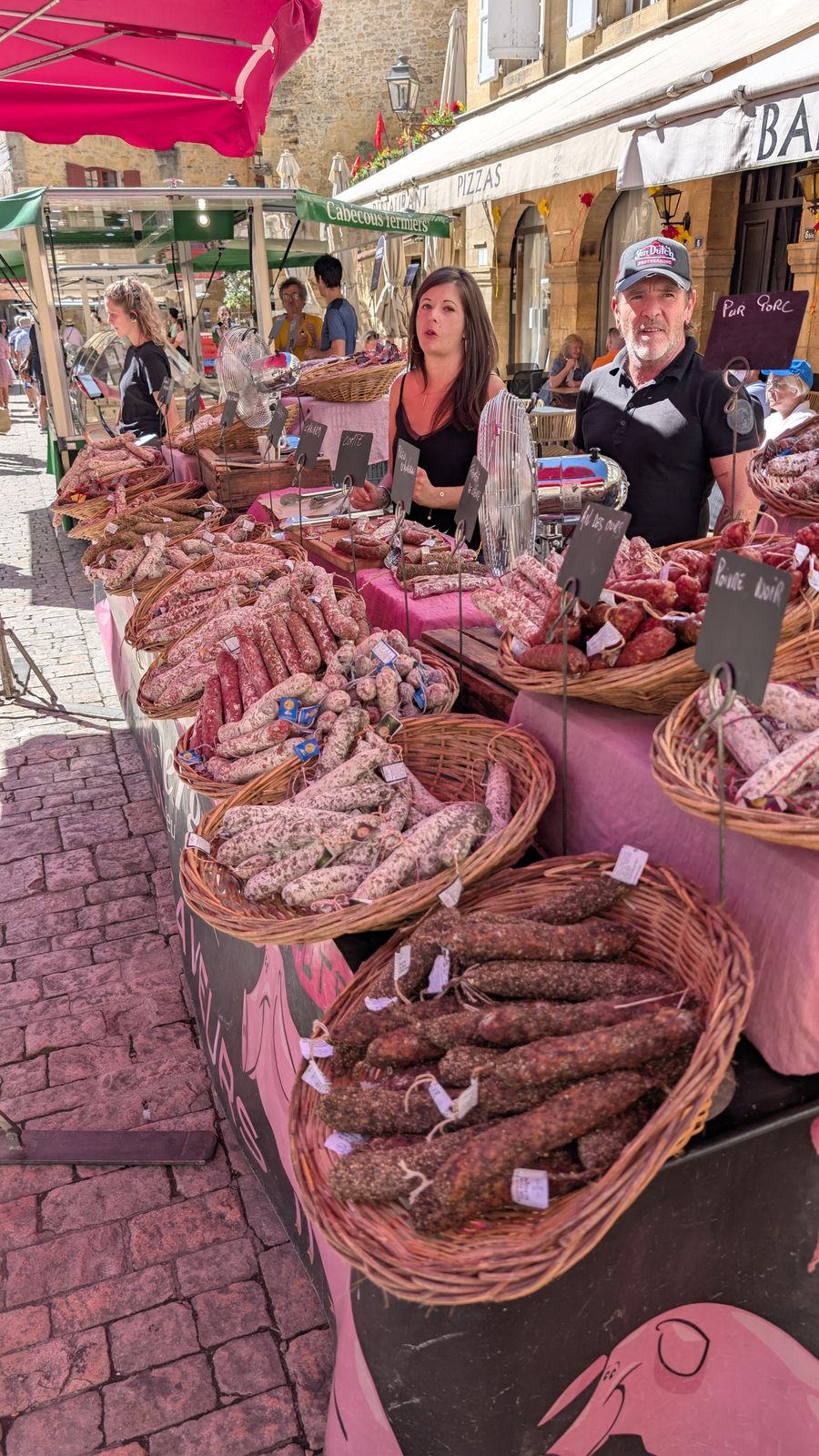 Baskets of saucisson on a market stall in Sarlat