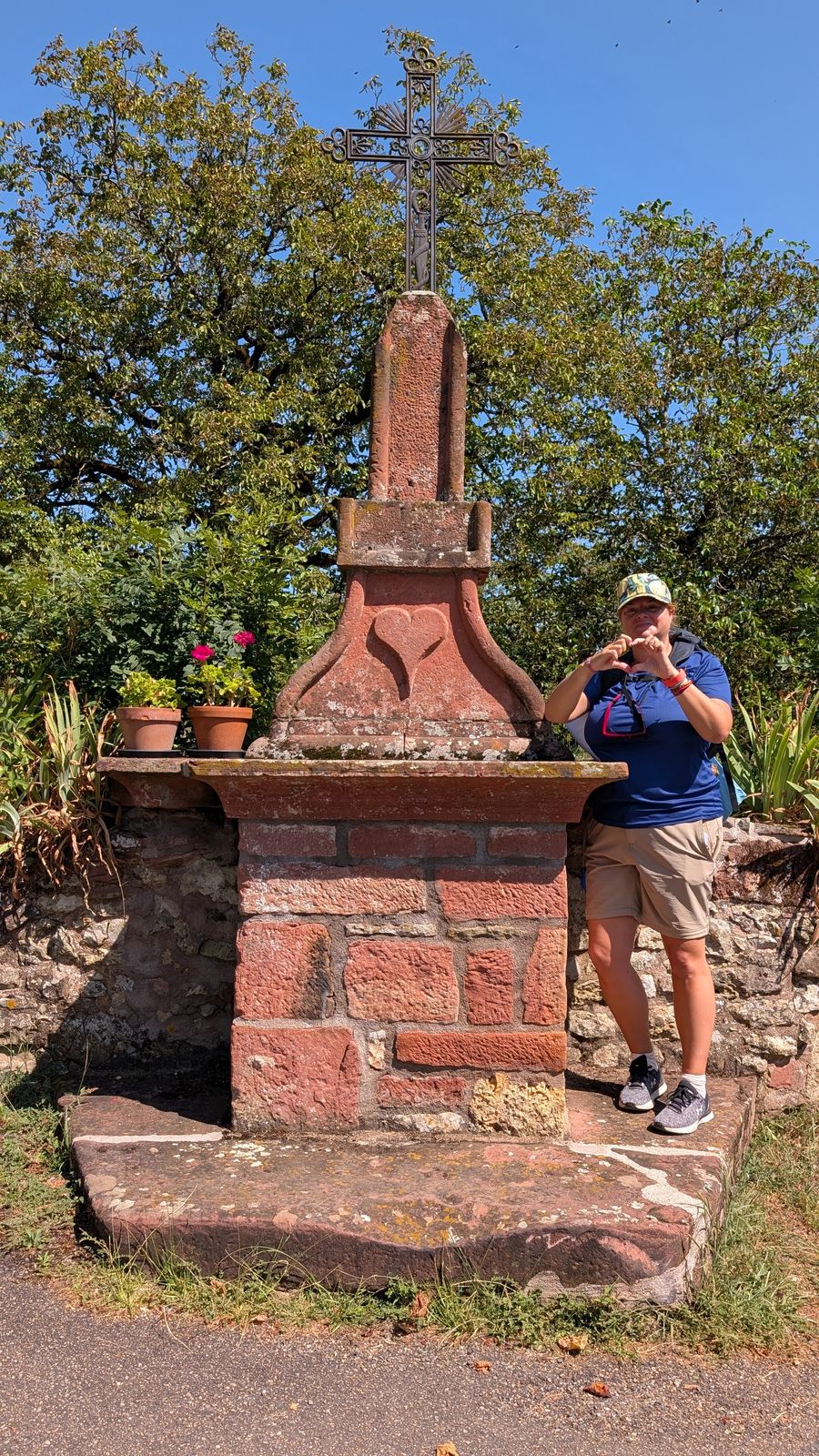 Kev photographing the old sandstone cross in Collonges-la-Rouge