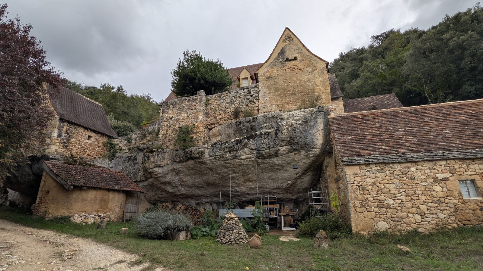 Stone houses built into a rock overhang near Les Eyzies