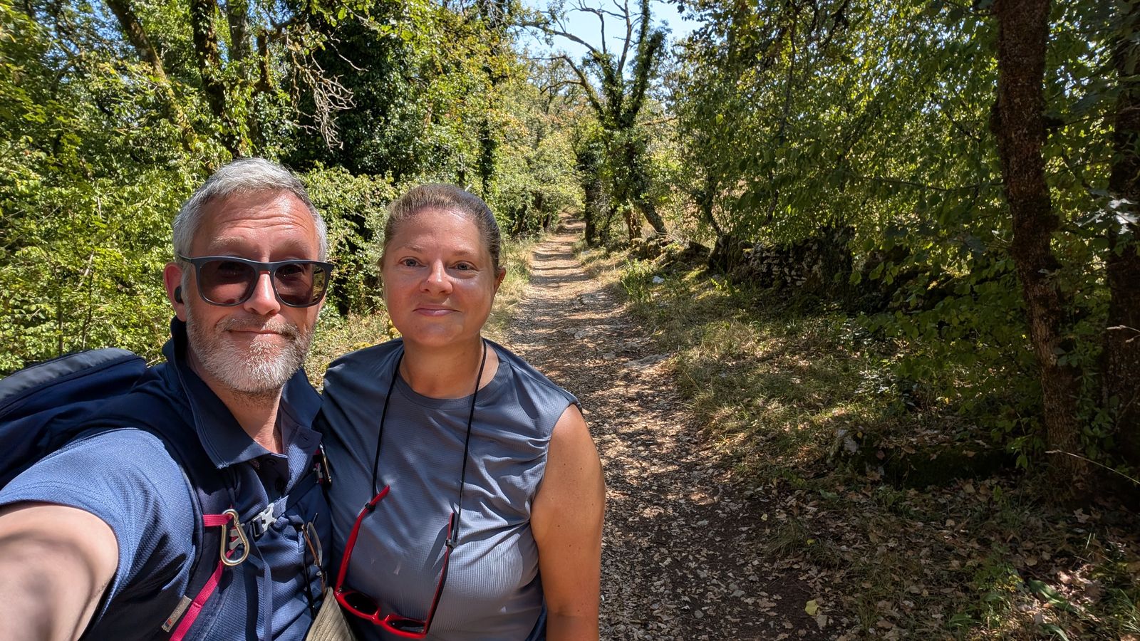 Kev and Cassie in sunglasses on a woodland track near Loubressac