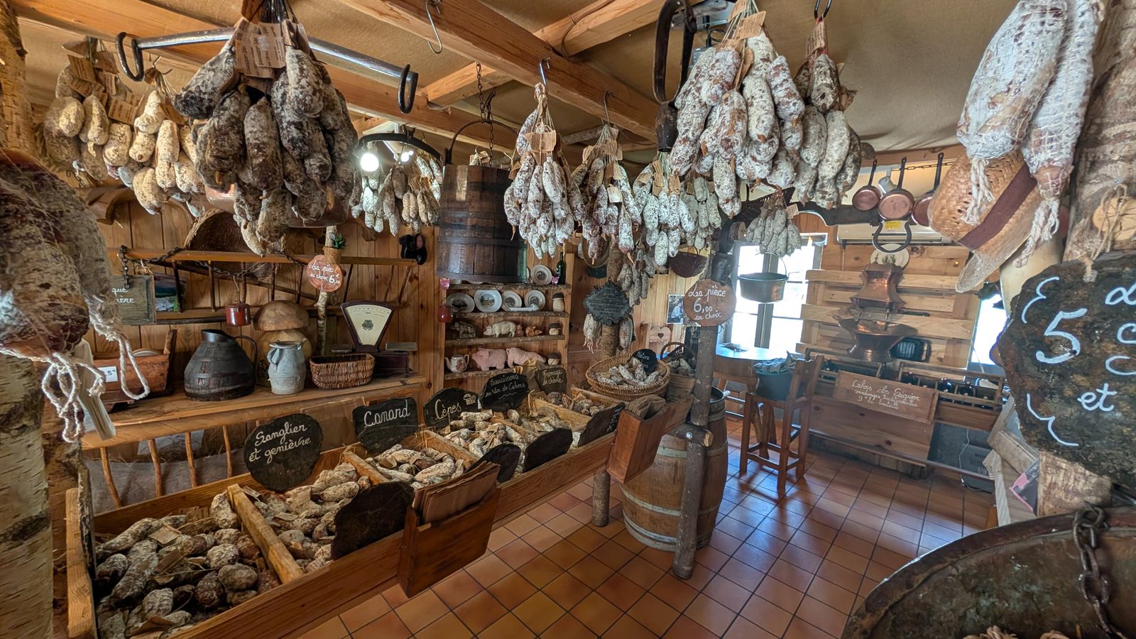 A shop interior hung with saucisson and stocked with local produce, Rocamadour