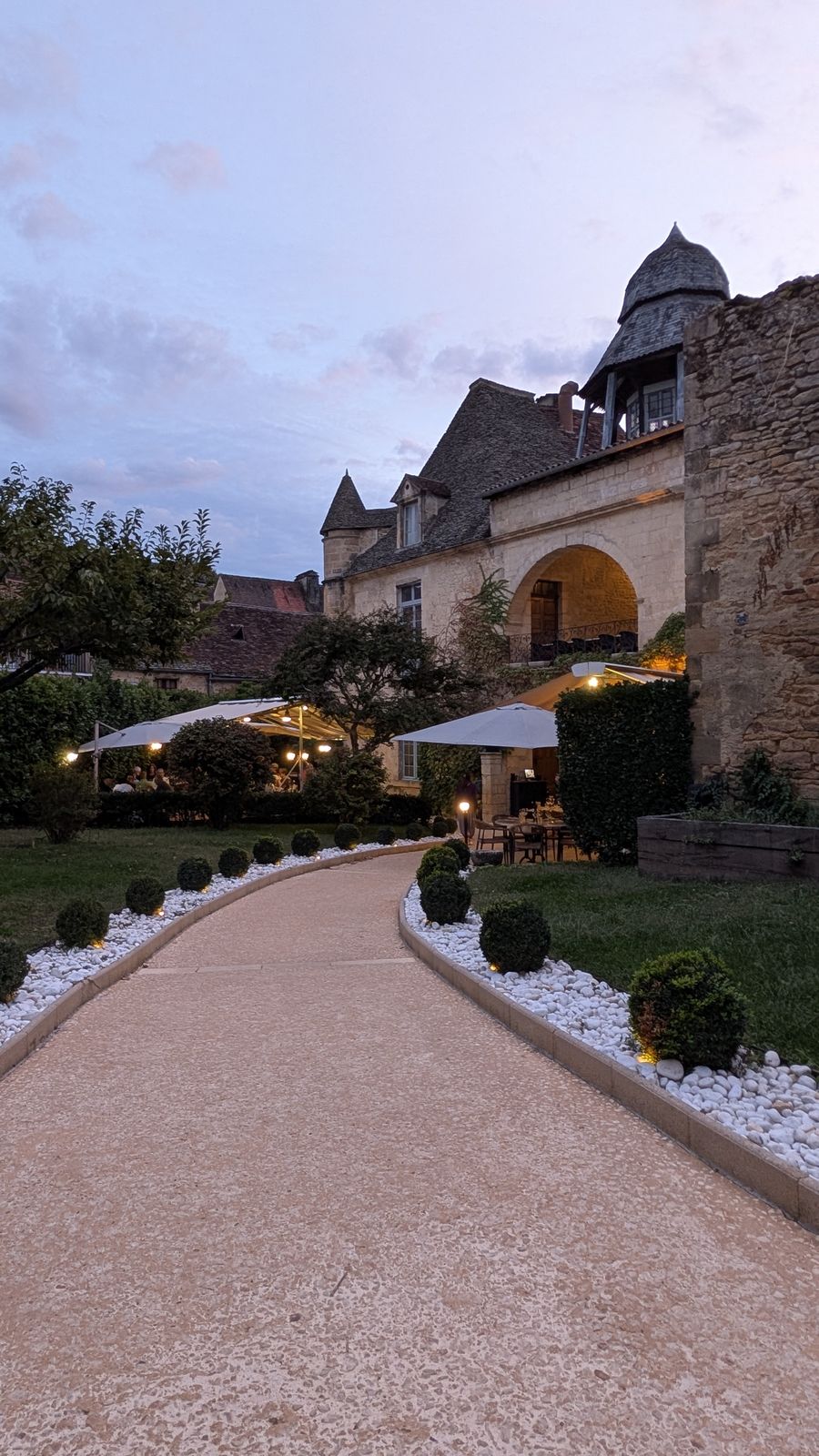 A garden path to an old manor house at dusk, Sarlat