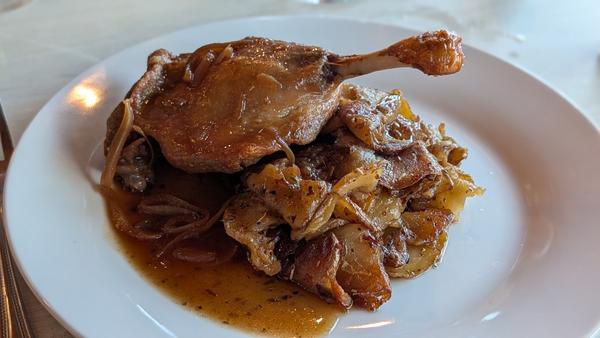 Duck confit on a bed of golden sautéed potatoes