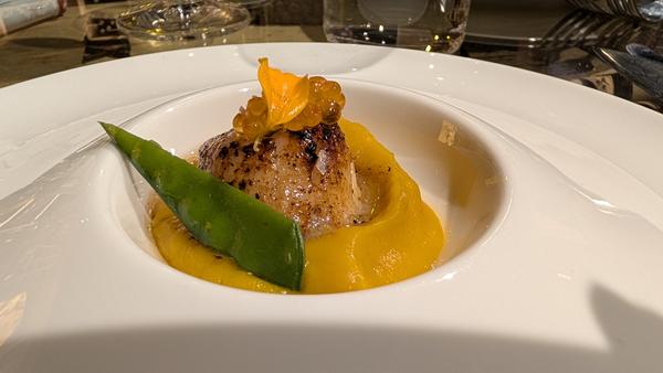 A scallop on squash purée with a mangetout (an example; the dishes change)