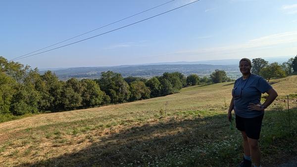 A walker pausing above the countryside near Carennac