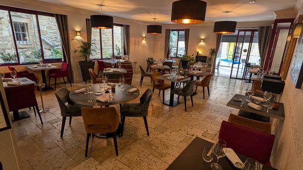 A restaurant dining room laid for dinner, Sarlat