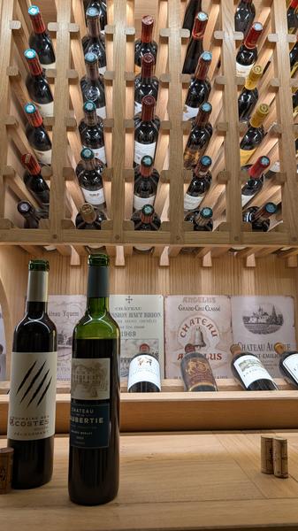 Bottles in the racks at Aux 3 Sens, Sarlat
