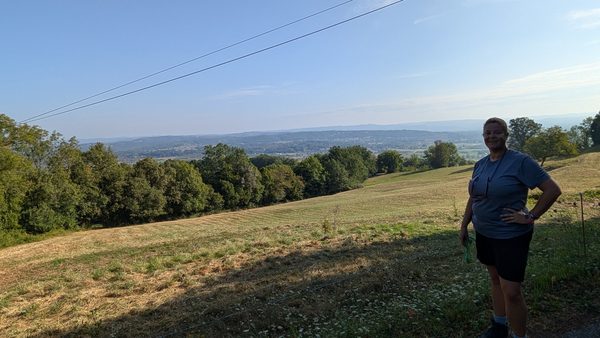 A walker pausing above the countryside near Carennac