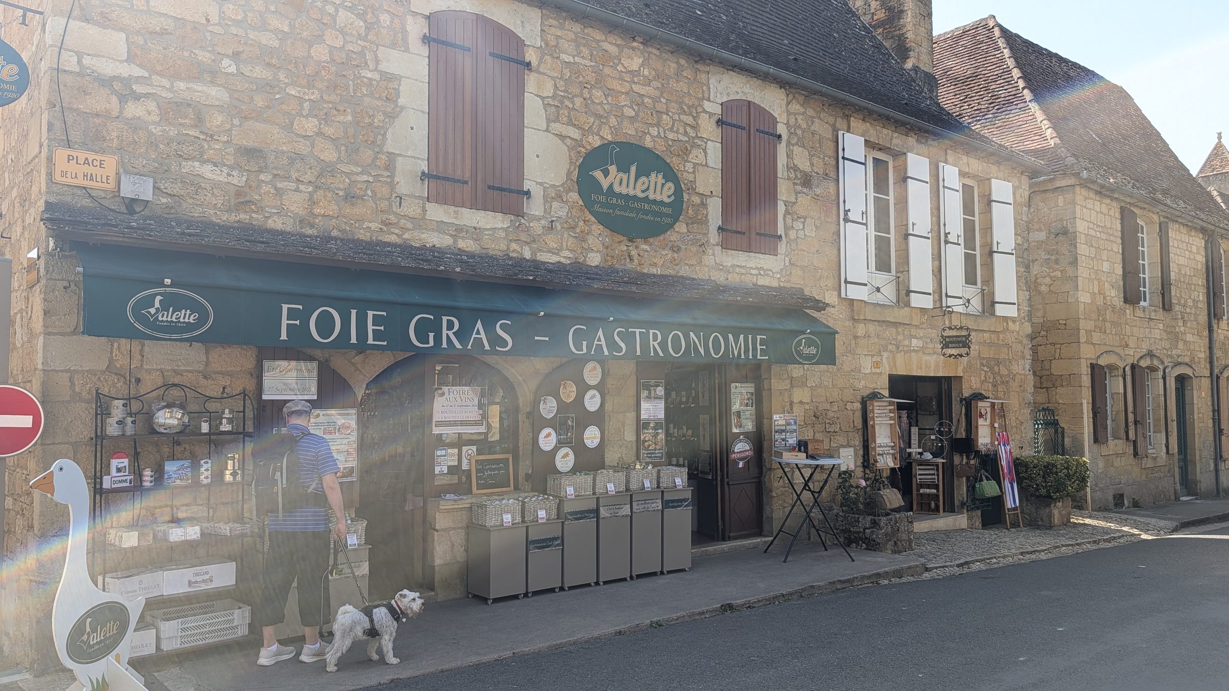 A foie gras and fine food shop on a golden-stone street in Domme
